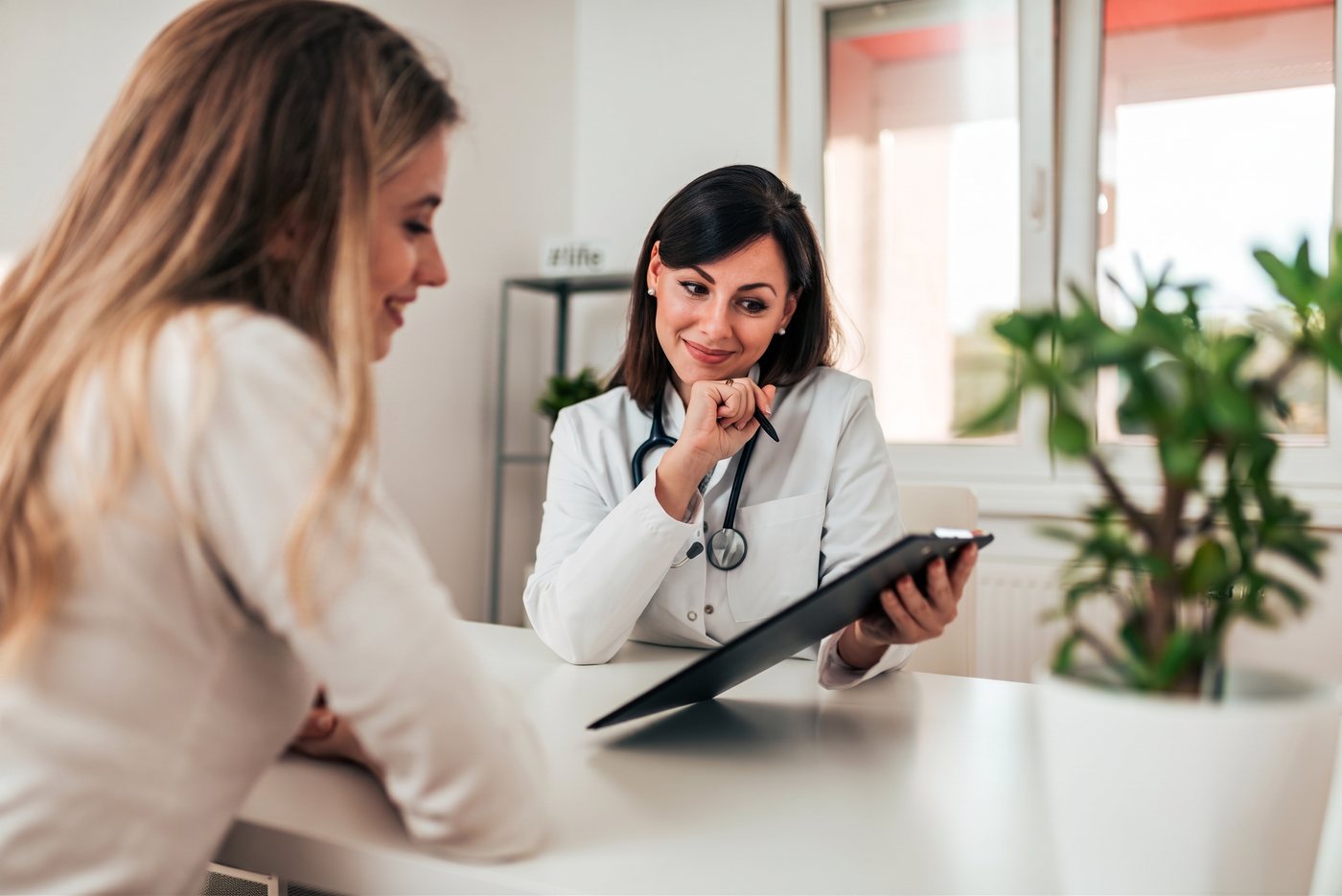 A doctor reviewing lab results with a patient at Citrin Longevity in West Hollywood
