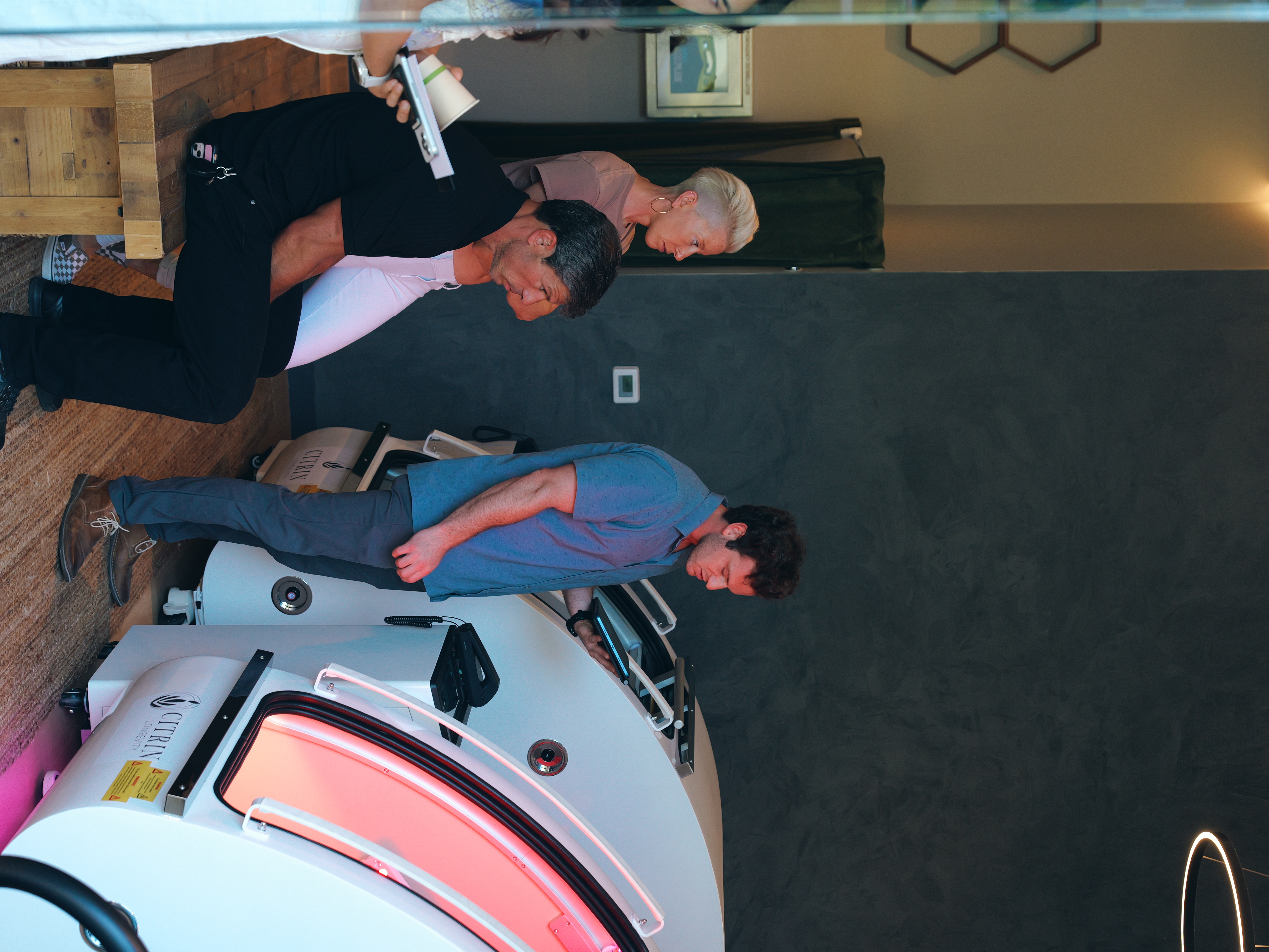 A Citrin Longevity team member guiding clients through a hyperbaric and red-light session at the West Hollywood clinic